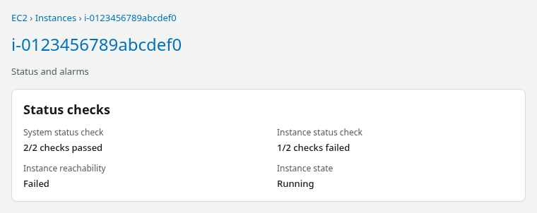 EC2 Status and alarms tab showing system status passed and instance reachability failed